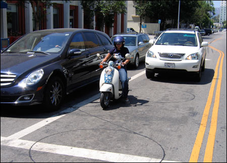 Photo: Author Pam Diaz in traffic on her scooter