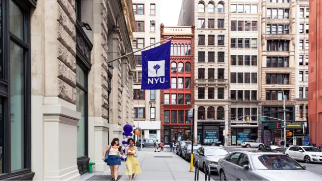NYU Wagner profile image of a street with a sign that has NYU Wagner's purple and white Logo