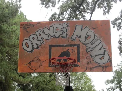 The backboar of a basketball hoop is painted orange with the words "orange Mound"--the name of a historically black neighborhood in Memphis, Tennessee.