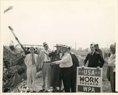 Eleanor Roosevelt talking with a project superintendent in Des Moines, Iowa. June 8, 1936. This project, sponsored by the Works Progress Administration, planned to convert a city dump into a water front park.