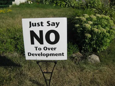 Clse-up of "Just Say No To Over Development" yard sign on green lawn