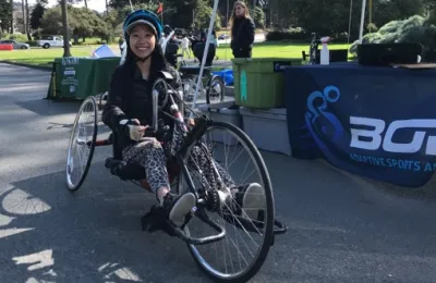 Woman sitting on recumbent bike