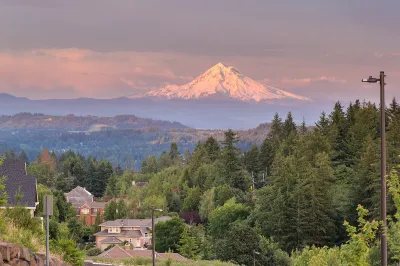 View of Mount Hood at golden hour with Happy Valley, Oregon homes in foreground.