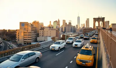 View of rush hour traffic on Brooklyn Bridge at golden hour.