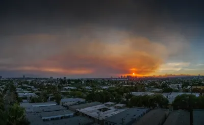 Smoky sky overlooking Los Angeles skyline during 2025 wildfires.