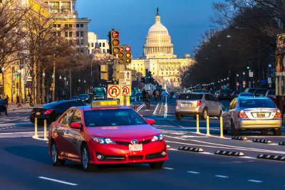 Traffic on Pennsylvania Avenue with U.S. Capitol dome in background