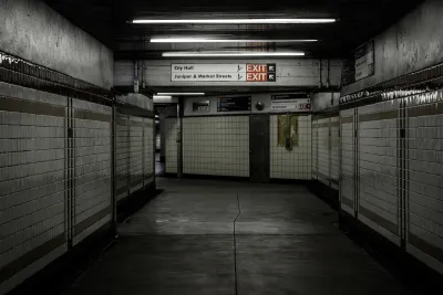 Empty hallway lined with white tile in subway station in Philadelphia, Pennsylvania.
