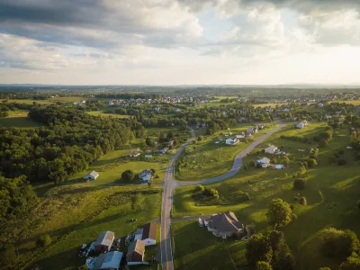 Aerial view of green rural community with houses in Pennsylvania.