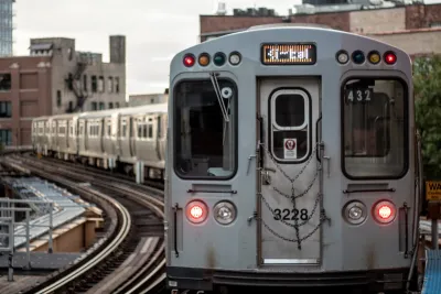 Silver train on elevated rail in Chicago, Illinois.
