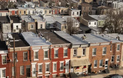 Aerial view of three-story brick rowhouses in Kensington neighborhood of Phialdelphia, Pennsylvania