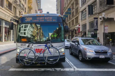 Muni bus with bike on front bike rack on San Francisco street