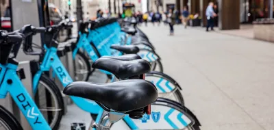 Close-up of town of blue Divvy bike share bikes parked at station in Chicago, Illinois.