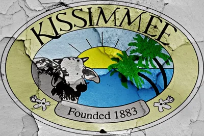 Kissimmee, Florida "Founded 1883" crest painted on cracked wall.