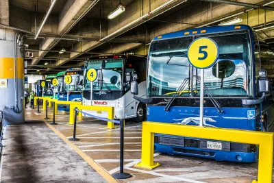 Row of blue intercity buses parked at Washington D.C. Union Station.