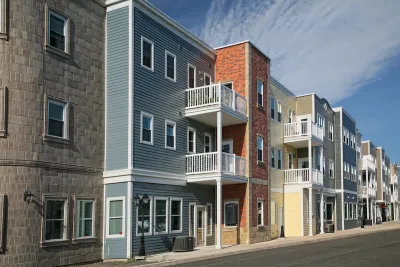 Colorful three-story multifamily housing.
