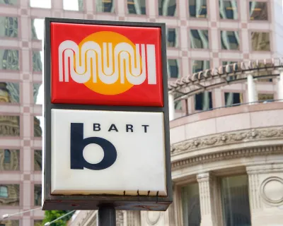 Close-up of sign at outdoor transit station for MUNI and BART in San Francisco, California.