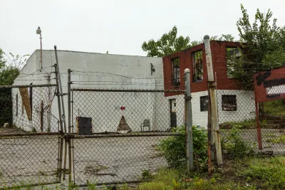 Abandoned, decaying building behind locked chain link fence in Atlanta, Georgia