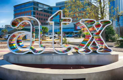 Colorful "atx" sign in front of Whole Foods store in Austin, Texas