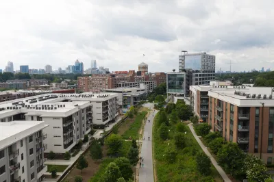 Aerial view of Atlanta BeltLine greenway with multistory buildings one ither side