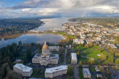 Aerial view of Olympia, Washington with state cpaitol dome in foreground on a somewhat cloudy day.