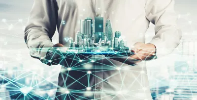 Digital drawing of person holding city skyline with wifi symbols and lines indicating smart cities or data.