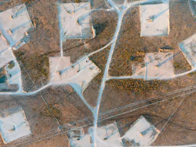 Bird's eye view of oil field in New Mexico desert.