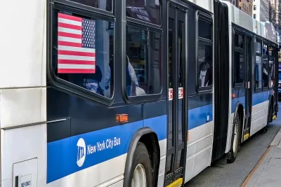 Close-up from back of blue and white New York City bus