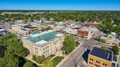 Aerial view of downtown Auburn, Indiana on a clear, sunny day.