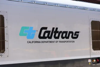 Close-up of Caltrans logo on white passenger train