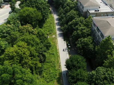 Aerial view of Atlanta BeltLine paved bike trail surrounded by green trees