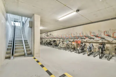 Bike parking in underground area with ramp for taking bikes upstairs.