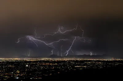 Lightning strikes over Tucson, Arizona at night during monsoon storm