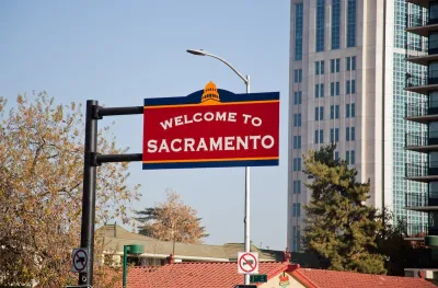 Red 'Welcome to Sacramento' sign in downtown Sacramento, California.