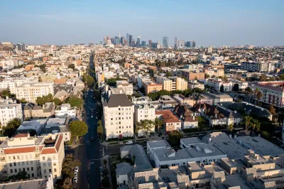 Aerial view of residential buildings in Koreatown, Los Angeles with downtown skyline in background