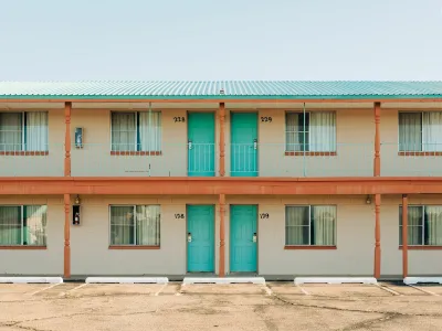 Roadside motel with turquoise room doors in Tucumcari, New Mexico.
