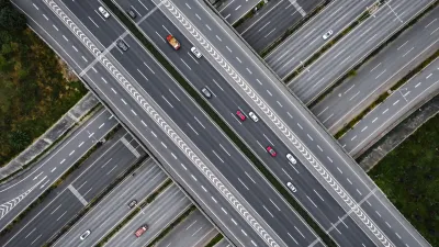 Overhead view of multilane elevated highway with multiple levels.