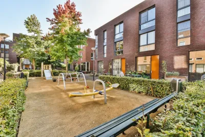 Playground in courtyard of apartment building.