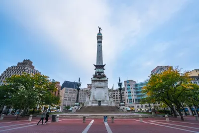 Soldiers and Sailors Monument in traffic circle in Indianapolis at twilight.