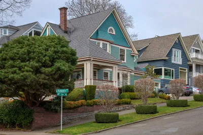 Teal and blue two-story houses in Seattle's historic Queen Anne neighborhood