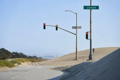 Great Highway roadway on San Francisco coast blocked by sand.
