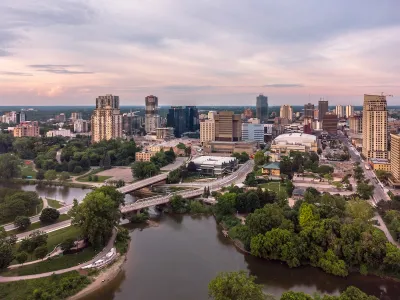 Aerial view of London, Ontario with river in foreground.