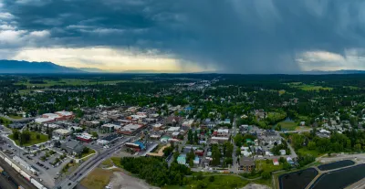 Aerial view of Whitefish, Montana with storm clouds in background