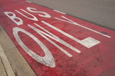 Close-up of red painted Bus Only lane.