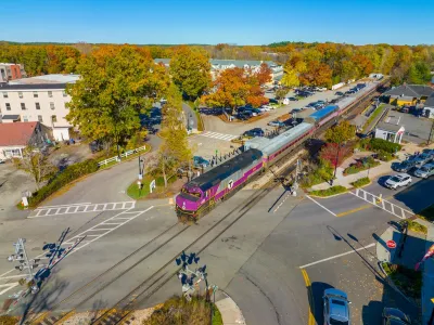 Aerial view of purple MBTA train at West Concord station in Concord, Massachusetts.