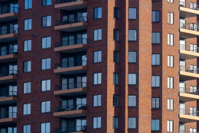 Close-up of facade of red brick high-rise apartment building in Columbus, Ohio.