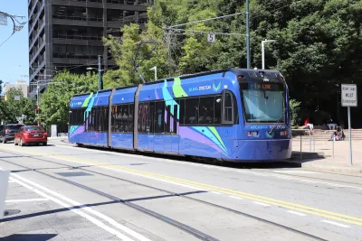 Blue Atlanta streetcar on street on sunny day in Atlanta, Georgia.