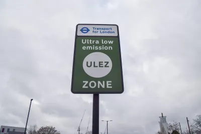 Close-up of green "Ultra low emission zone" ULEZ sign in London, UK.