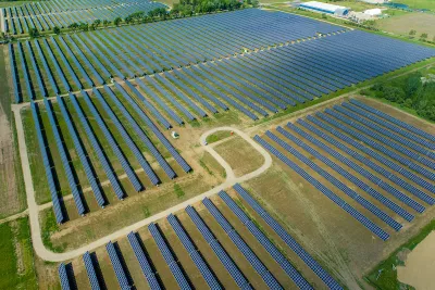 Aerial view of large solar panel installation in rural area in Indiana.