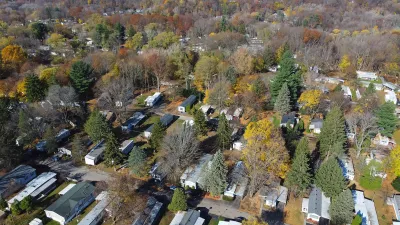 Aerial view of mobile home park with mature trees in Rochester, New York.