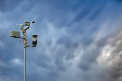 Weather station against stormy sky.